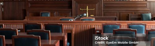 Empty Chairs And Tables In Courtroom